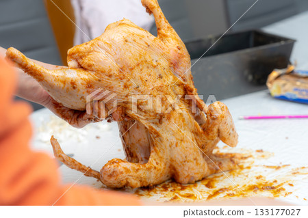 cutting chicken on the cutting board 133177027