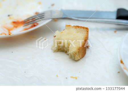 baked potato slices on black plate 133177044