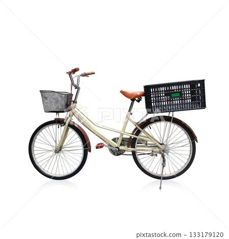 side view antique cream and brown color bicycle and black front grill and black plastic crate on white background, decor, object, fashion, transporation, copy space 133179120