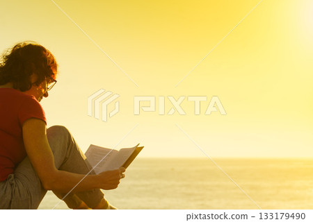 Woman on sea read book, relaxing Woman on sea read book, relaxing 133179490