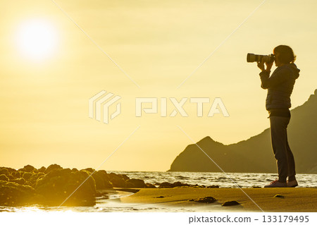 Woman with camera on Monsul beach, Spain 133179495