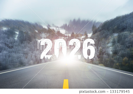 Empty asphalt road leading into snowy forest mountains with large glowing number 2026 at the horizon. Ideal for themes of motivation, inspiration, future, new year and fresh beginnings in 2026. Empty asphalt road leading into snowy forest mountains with large glowing number 2026 at the horizon. Ideal for themes of motivation, inspiration, future, new year and fresh beginnings in 2026. 133179545