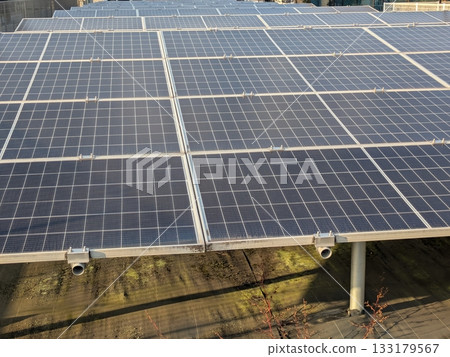Numerous photovoltaic solar panels spread across the site 133179567