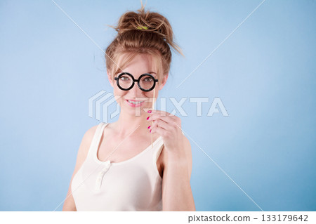 Elegant woman pretending wearing eyeglasses Elegant woman pretending wearing eyeglasses 133179642