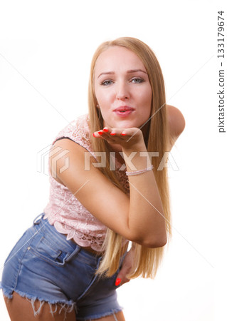 Woman sending air kiss 133179674