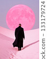 man in a long coat walking on a textured terrain with a giant pink moon. 133179724