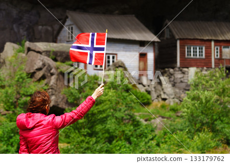 Tourist visiting Helleren houses in Jossingfjord, Norway 133179762