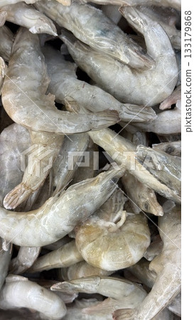 Raw shrimp seafood piled together as a background for culinary or market-related concepts 133179868