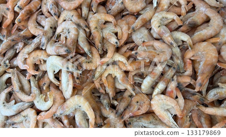 Fresh shrimp piled together, showcasing seafood texture and concept, perfect for cooking background Fresh shrimp piled together, showcasing seafood texture and concept, perfect for cooking background 133179869