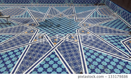 Decorative geometric mosaic pattern featuring shades of blue and white, suitable for background use 133179886