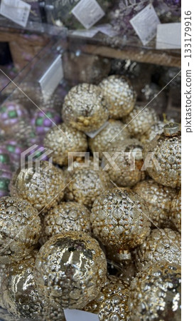 Christmas ornaments with intricate gold designs in a festive display setting, perfect for decoration Christmas ornaments with intricate gold designs in a festive display setting, perfect for decoration 133179916