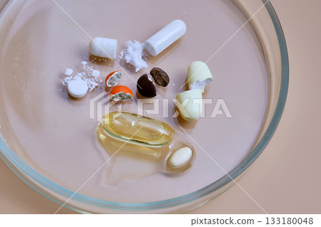 Pills and supplements in petri dish for analysis Pills and supplements in petri dish for analysis 133180048