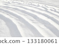 Pattern of curved furrows in the snow full frame 133180061