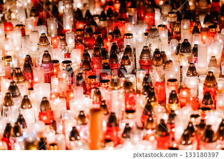 Glowing Memorial Candles in Red and White Creating a Peaceful Night Atmosphere Glowing Memorial Candles in Red and White Creating a Peaceful Night Atmosphere 133180397