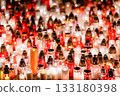 Glowing Memorial Candles in Red and White Creating a Peaceful Night Atmosphere 133180398