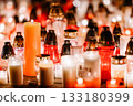 Glowing Memorial Candles in Red and White Creating a Peaceful Night Atmosphere 133180399