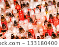 Glowing Memorial Candles in Red and White Creating a Peaceful Night Atmosphere 133180400