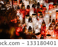 Glowing Memorial Candles in Red and White Creating a Peaceful Night Atmosphere 133180401