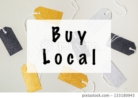 Colorful tags with 'Buy Local' message on a light background promoting local shopping initiative 133180943