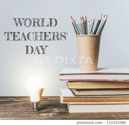 A stack of books with a light bulb on top of them 133181006