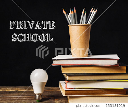 a light bulb on a table with the words Private School 133181019