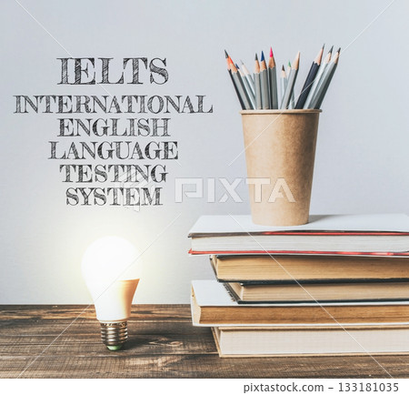 Creative workspace with books, light bulb, and pencil holder for educational inspiration Creative workspace with books, light bulb, and pencil holder for educational inspiration 133181035