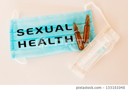 Blue surgical mask with the word sexual health written on it Blue surgical mask with the word sexual health written on it 133181048