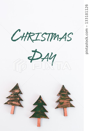 Decorative Christmas trees on white background with festive text celebrating Christmas Day Decorative Christmas trees on white background with festive text celebrating Christmas Day 133181126