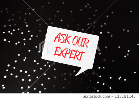 White and red sign that says Ask Our Expert is on a black background 133181145