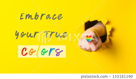 Hand holding a rainbow heart with the words embrace your true colors Hand holding a rainbow heart with the words embrace your true colors 133181190