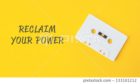 Vintage cassette tape on bright yellow background with motivational text for creative projects Vintage cassette tape on bright yellow background with motivational text for creative projects 133181212
