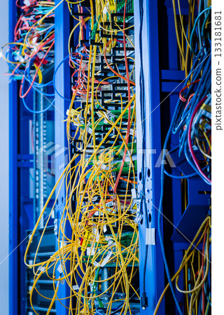 Server rack with fiber optic cables attached to front panel swit Server rack with fiber optic cables attached to front panel swit 133181681