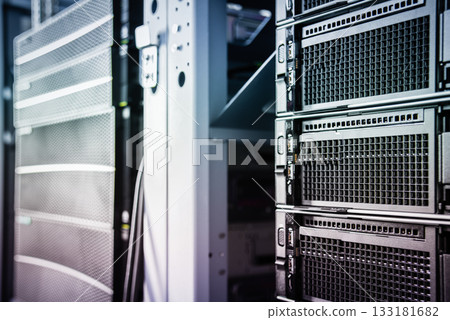 cluster of data storage SSD hard drives inside server rack 133181682