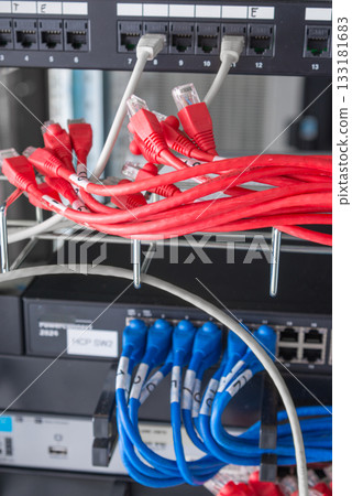 red ethernet cables connected to switch 133181683