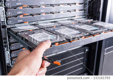 Cloud storage service, engineer pulling out panel and swapping h 133181705