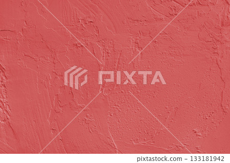 Close up red colored painted plaster wall surface background with rough brushstrokes texture 133181942