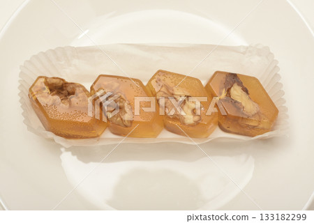 Orange marmalade with nuts. A sweet snack. 133182299