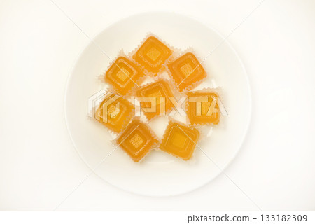 Orange marmalade. A sweet snack. Marmalade with different flavors and colors. Orange marmalade. A sweet snack. Marmalade with different flavors and colors. 133182309