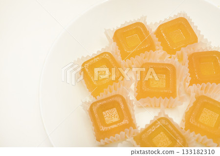 Orange marmalade. A sweet snack. Marmalade with different flavors and colors. Orange marmalade. A sweet snack. Marmalade with different flavors and colors. 133182310