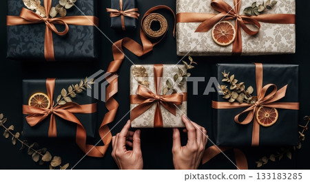 Luxury Gift Wrapping Flat Lay with Artisan Paper Textures, Twine, and Dried Botanicals in Moody Lighting 133183285