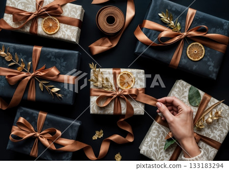 Luxury Gift Wrapping Flat Lay with Artisan Paper Textures, Twine, and Dried Botanicals in Moody Lighting 133183294