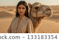 Woman with camel in desert 133183354