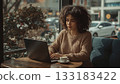 Woman Working on Laptop with Coffee   133183422