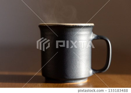 Coffee in the evening | Cup and steam 133183488