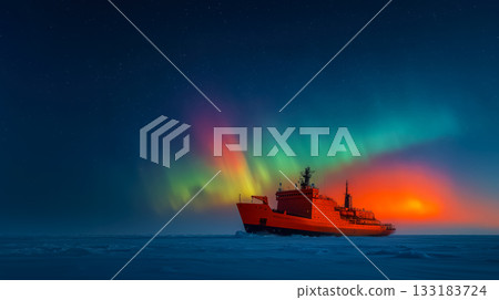 An icebreaker navigates the ice with the aurora borealis during the polar night, opening new trade routes along the Northern Sea Route 133183724