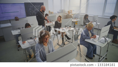 Group of Mature Students Study Together in Bright Modern Computer Classroom 133184181