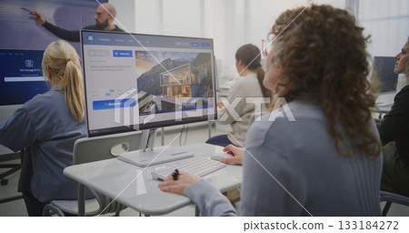 Adult Students in Modern Classroom Learning AI and Digital Design. 133184272