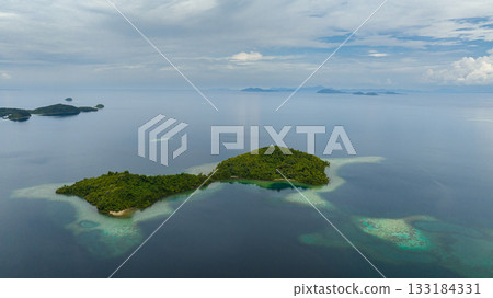 Top view of tropical islands with lagoons. Seascape in the tropics. Borneo, Sabah, Malaysia. Top view of tropical islands with lagoons. Seascape in the tropics. Borneo, Sabah, Malaysia. 133184331