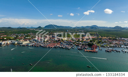 Aerial view of Semporna, on the southeastern coast of the state of Sabah in Malaysia, is a county in the Tawau District. Aerial view of Semporna, on the southeastern coast of the state of Sabah in Malaysia, is a county in the Tawau District. 133184334