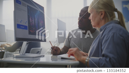 Young Instructor Explains AI Image Generation Process Senior Female Student During Creative Tech Lesson 133184352